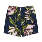 Lily Men's Board Shorts flat lay — full lily illustration on quick-drying men's swimwear, Wild Lines Collection by Atme